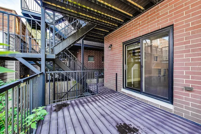 a front view of residential houses with an outdoor space