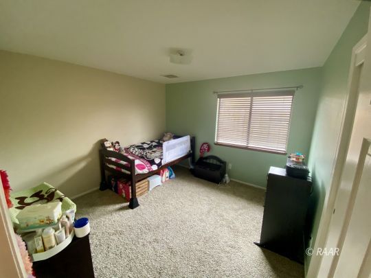 813 Charles Court Ridgecrest, CA 93555 - Photo 12 of 20 a living room with furniture and a window