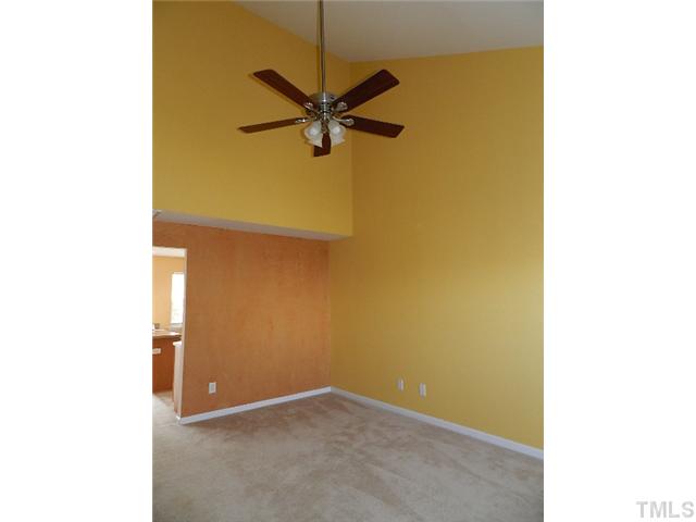 8020 River Watch Lane Raleigh, NC 27616 - Photo 2 of 10 a view of a hallway with a yellow plant