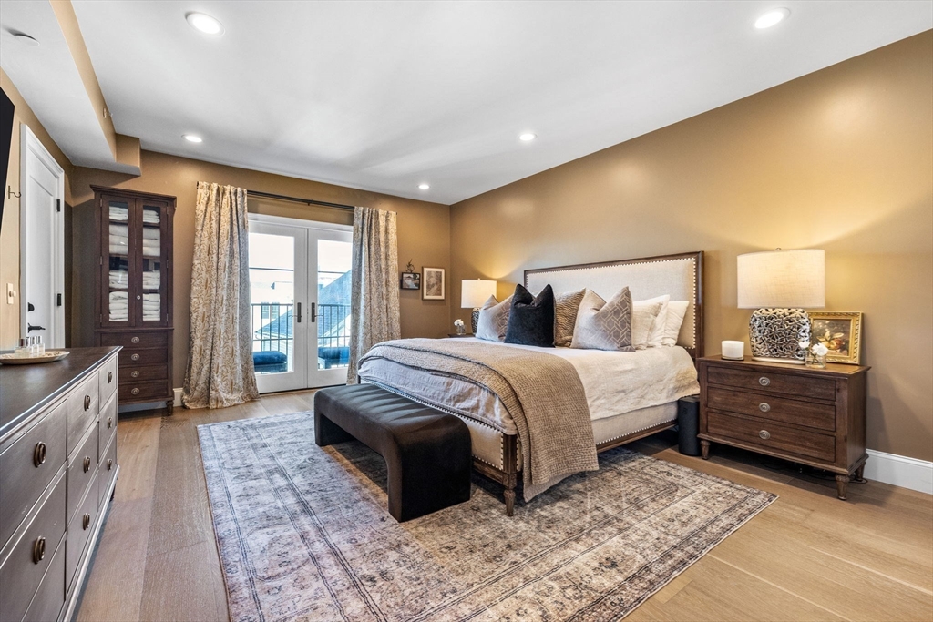 258-260 West 3rd Street, Unit 1 Boston, MA 02127 - Photo 16 of 37 a spacious bedroom with a bed and wooden floor