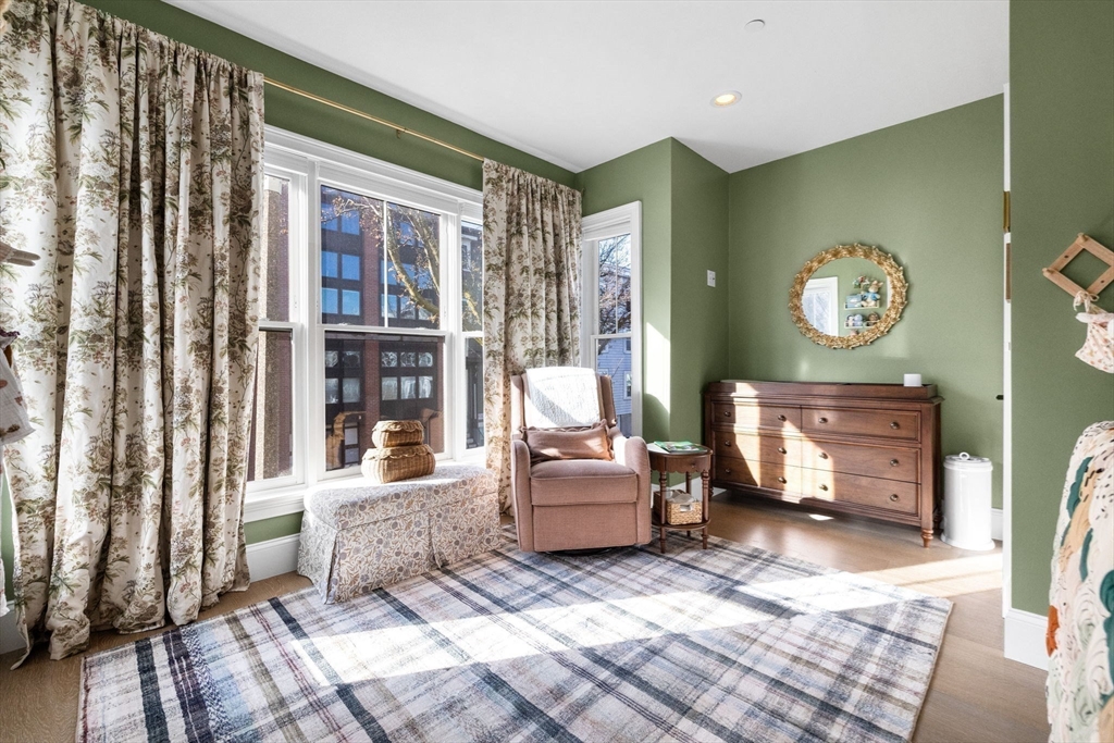 258-260 West 3rd Street, Unit 1 Boston, MA 02127 - Photo 22 of 37 a living room with furniture and a fireplace