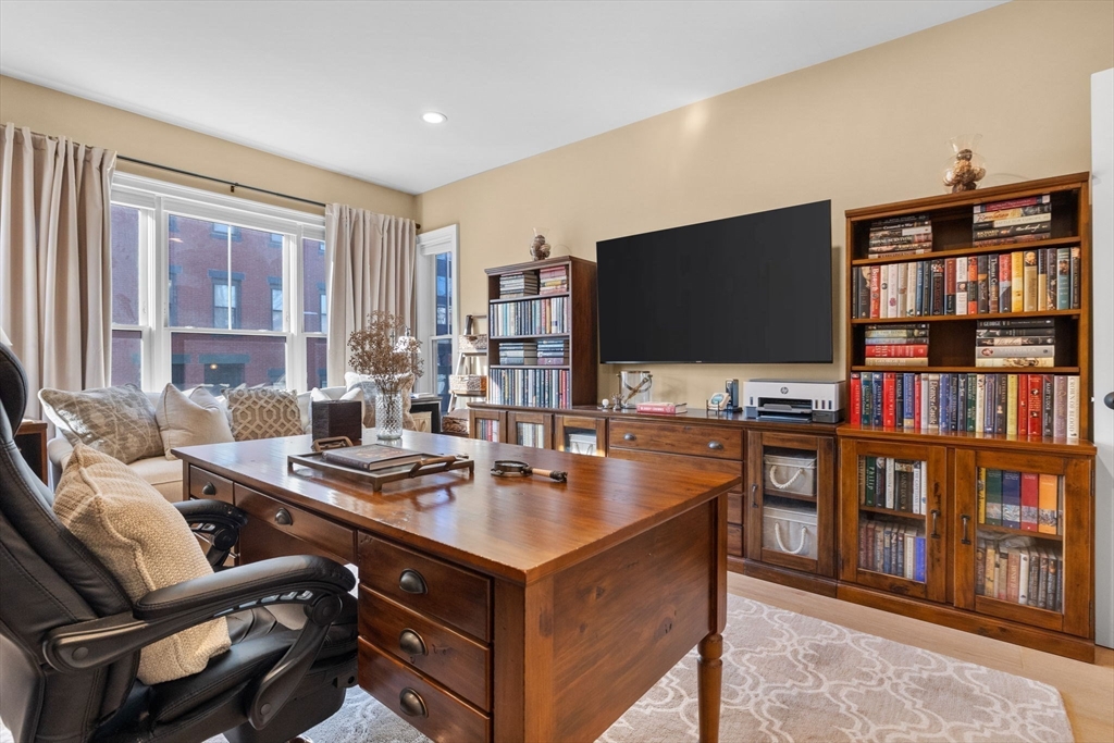 258-260 West 3rd Street, Unit 1 Boston, MA 02127 - Photo 28 of 37 a living room with furniture and a flat screen tv