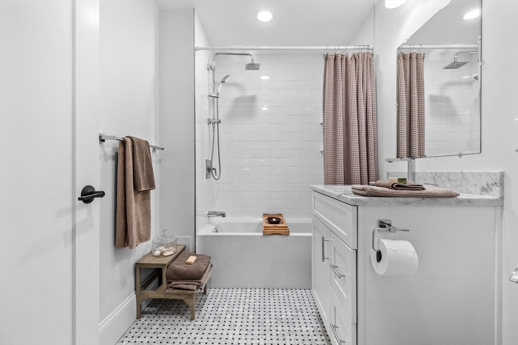 258-260 West 3rd Street, Unit 1 Boston, MA 02127 - Photo 31 of 37 a bathroom with a tub shower sink and toilet