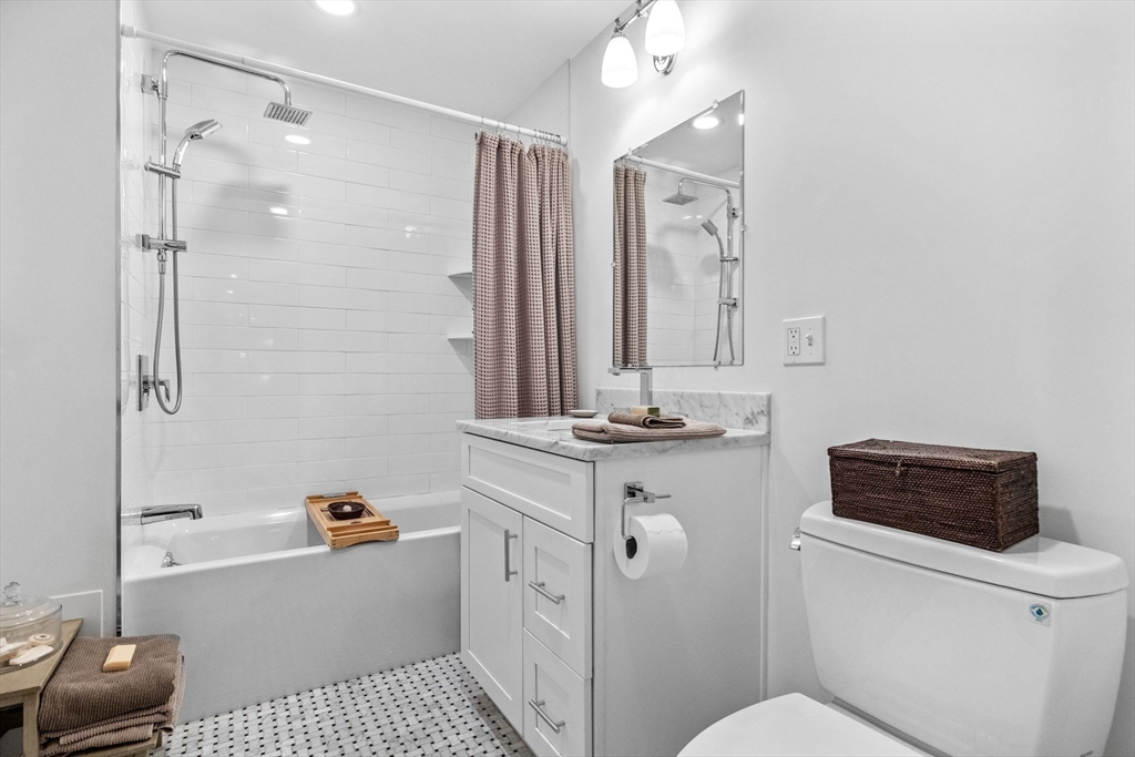 258-260 West 3rd Street, Unit 1 Boston, MA 02127 - Photo 33 of 37 a bathroom with a sink a toilet and shower