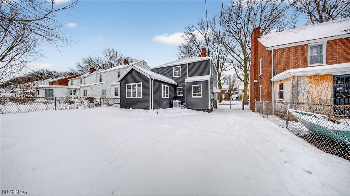 16811 Invermere Avenue Cleveland, OH 44128 - Photo 4 of 47 Snow covered house with a chimney