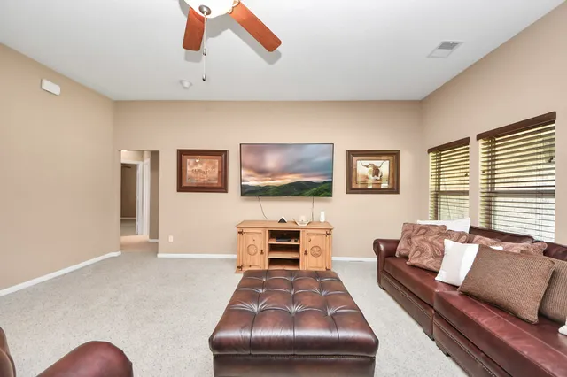 a view of a pool an outdoor space and seating area