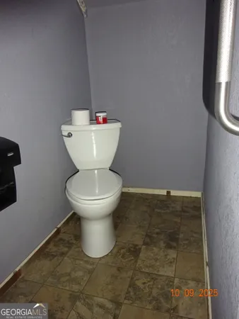 a bathroom with a toilet and a sink