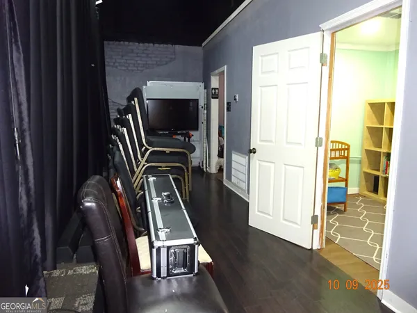 a view of a livingroom with furniture and a window