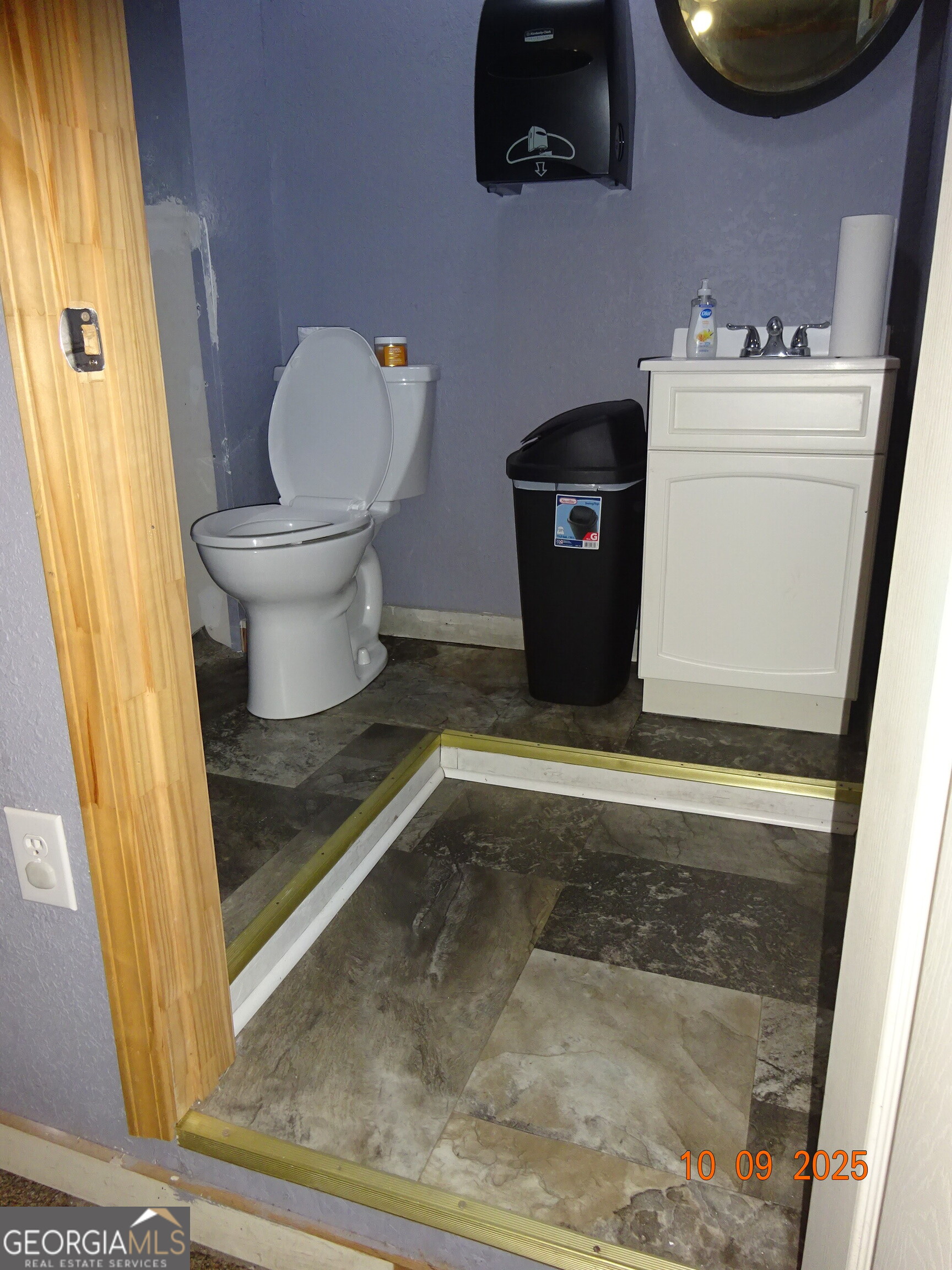 1 East Railroad Street Claxton, GA 30417 - Photo 10 of 21 a bathroom with a toilet and a mirror