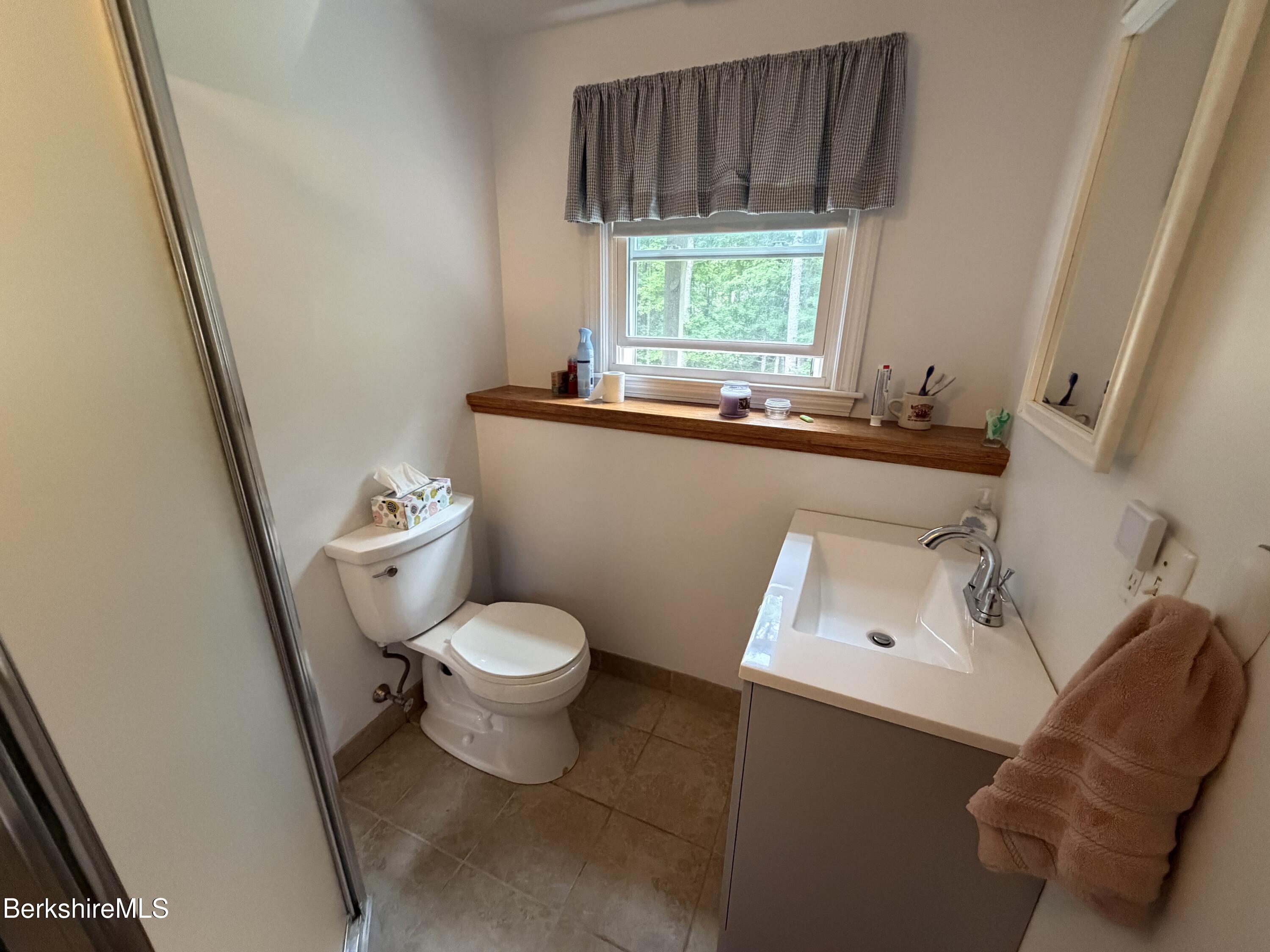 20 Sullivan Lane Lenox, MA 01240 - Photo 12 of 23 a white toilet sitting next to a window