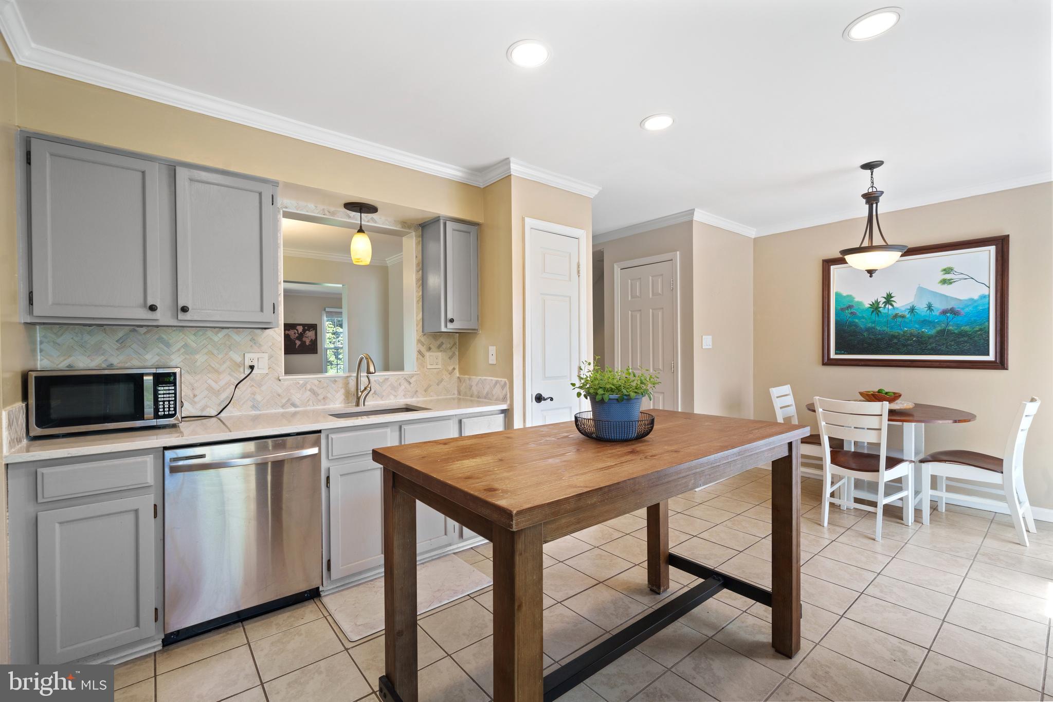 11279 Kessler Place Manassas, VA 20109 - Photo 14 of 39 a kitchen with a sink cabinets and window