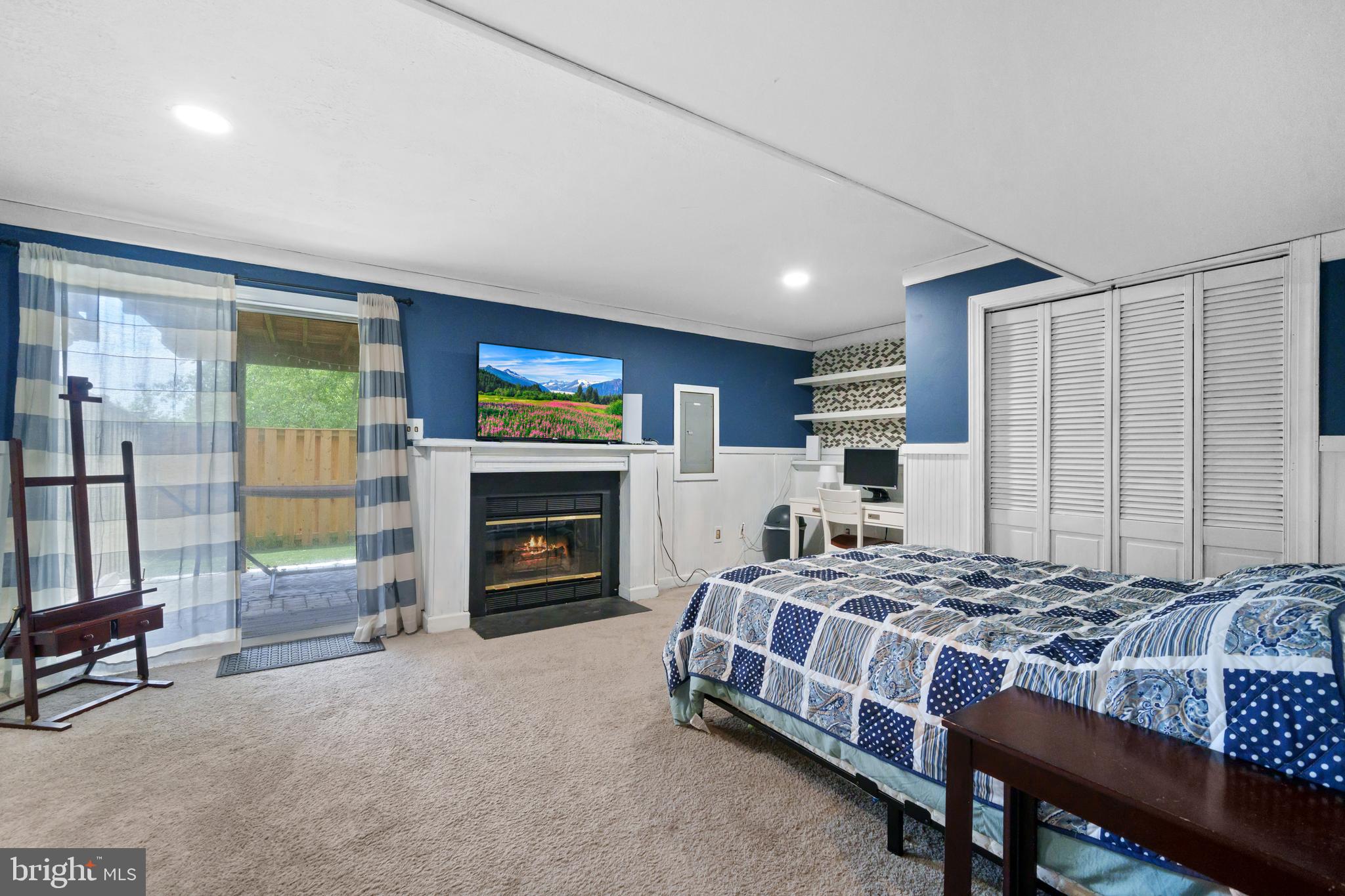 11279 Kessler Place Manassas, VA 20109 - Photo 25 of 39 a bedroom with a bed and a fireplace