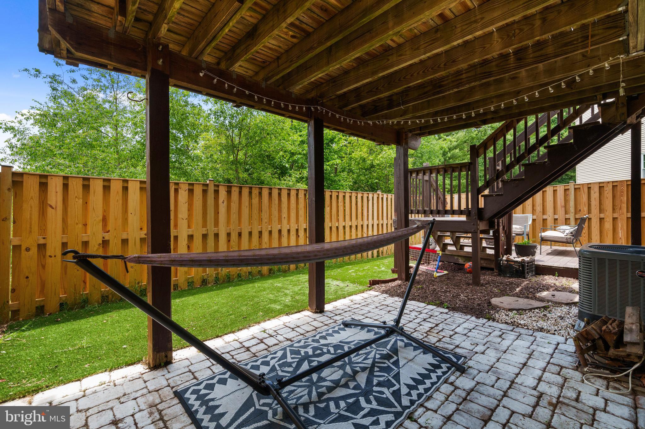11279 Kessler Place Manassas, VA 20109 - Photo 31 of 39 a view of a patio with wooden floor a yard tables and chairs