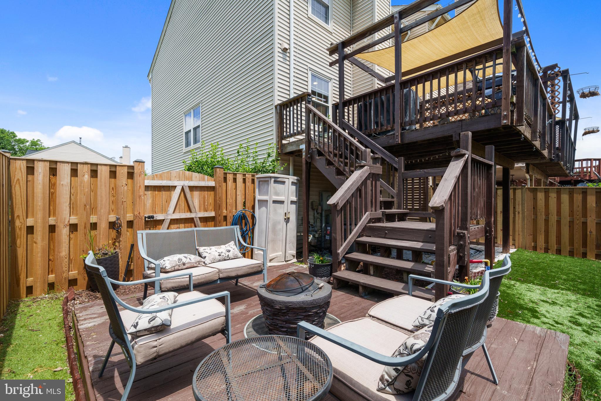 11279 Kessler Place Manassas, VA 20109 - Photo 33 of 39 a view of a patio with table and chairs with wooden floor and fence