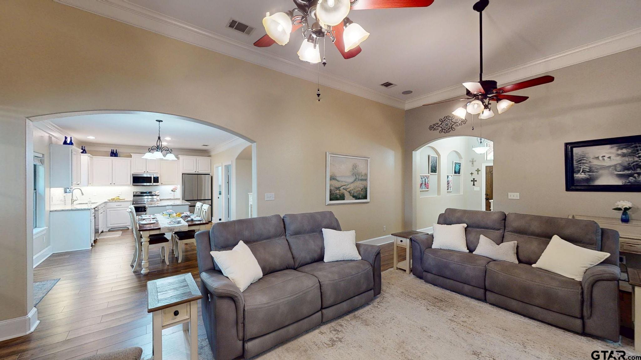 18488 Bluebird Circle Flint, TX 75762 - Photo 4 of 47 a living room with furniture a chandelier and a flat screen tv
