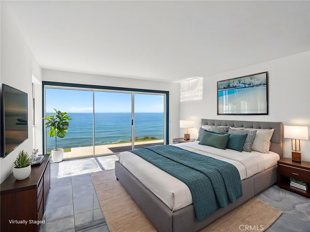 14800 Navarro Way Manchester, CA 95459 - Photo 24 of 50 a bedroom with a large bed and a large window