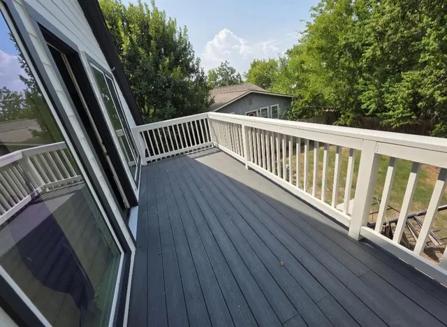 a view of balcony with wooden floor