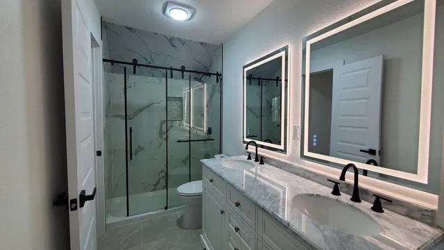 a bathroom with 2 sink tub and a mirror