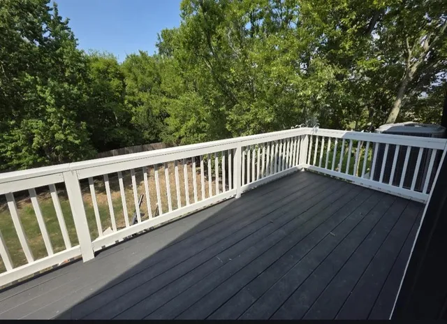 a view of balcony with wooden floor