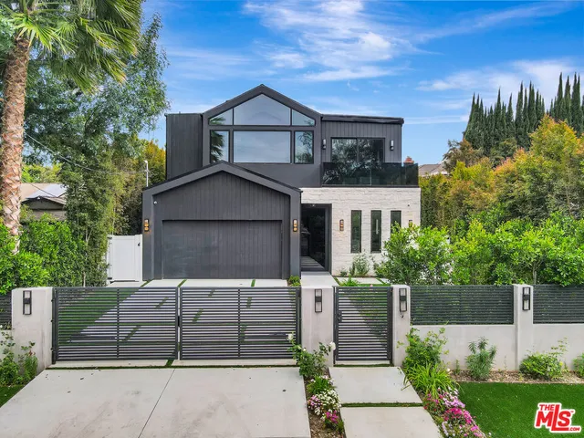 a living room with furniture pool table and a large window