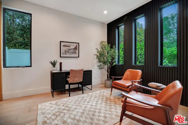 a kitchen with stainless steel appliances kitchen island granite countertop a refrigerator and a stove top oven