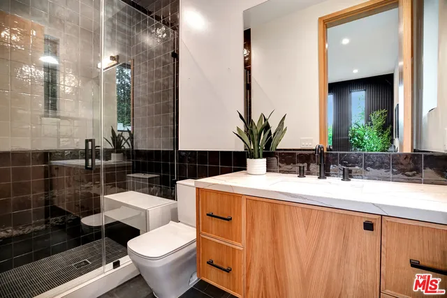 a spacious bedroom with a bed and a couch