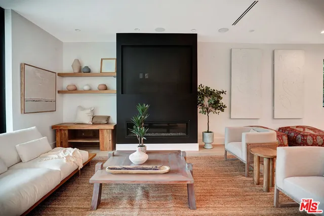 a view of room with furniture and wooden floor