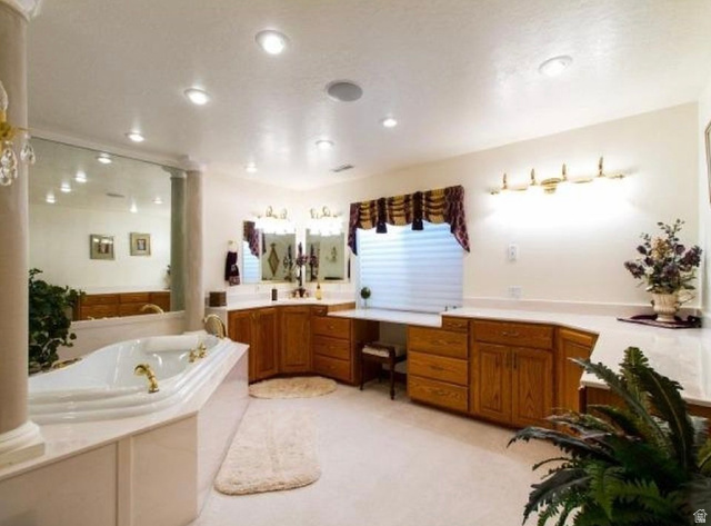 1085 Windsor Drive Provo, UT 84604 - Photo 31 of 83 Full bath featuring a garden tub, vanity, and light carpet