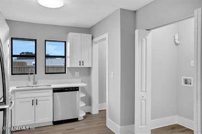 2125 Gilmore Street Jacksonville, FL 32204 - Photo 12 of 18 a kitchen with white cabinets and window