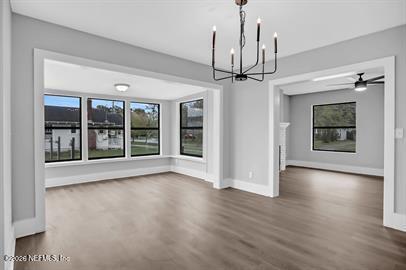 2125 Gilmore Street Jacksonville, FL 32204 - Photo 7 of 18 a view of an empty room with wooden floor and a window