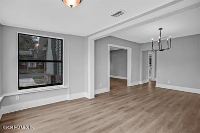 2125 Gilmore Street Jacksonville, FL 32204 - Photo 8 of 18 a view of empty room with wooden floor and window