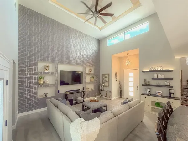 a living room with furniture and a flat screen tv