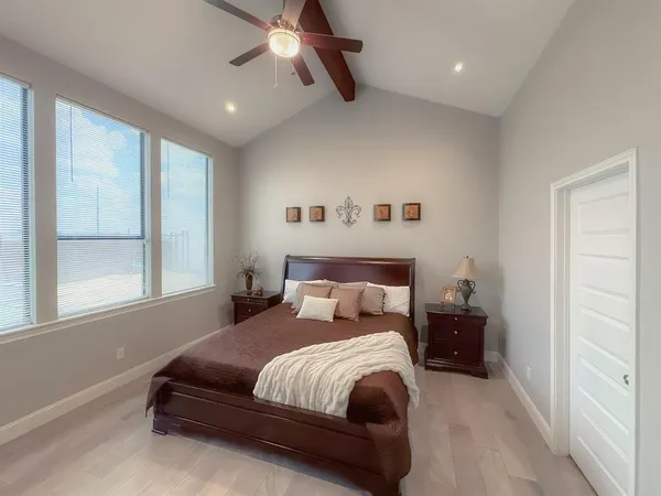 a bedroom with bed and window