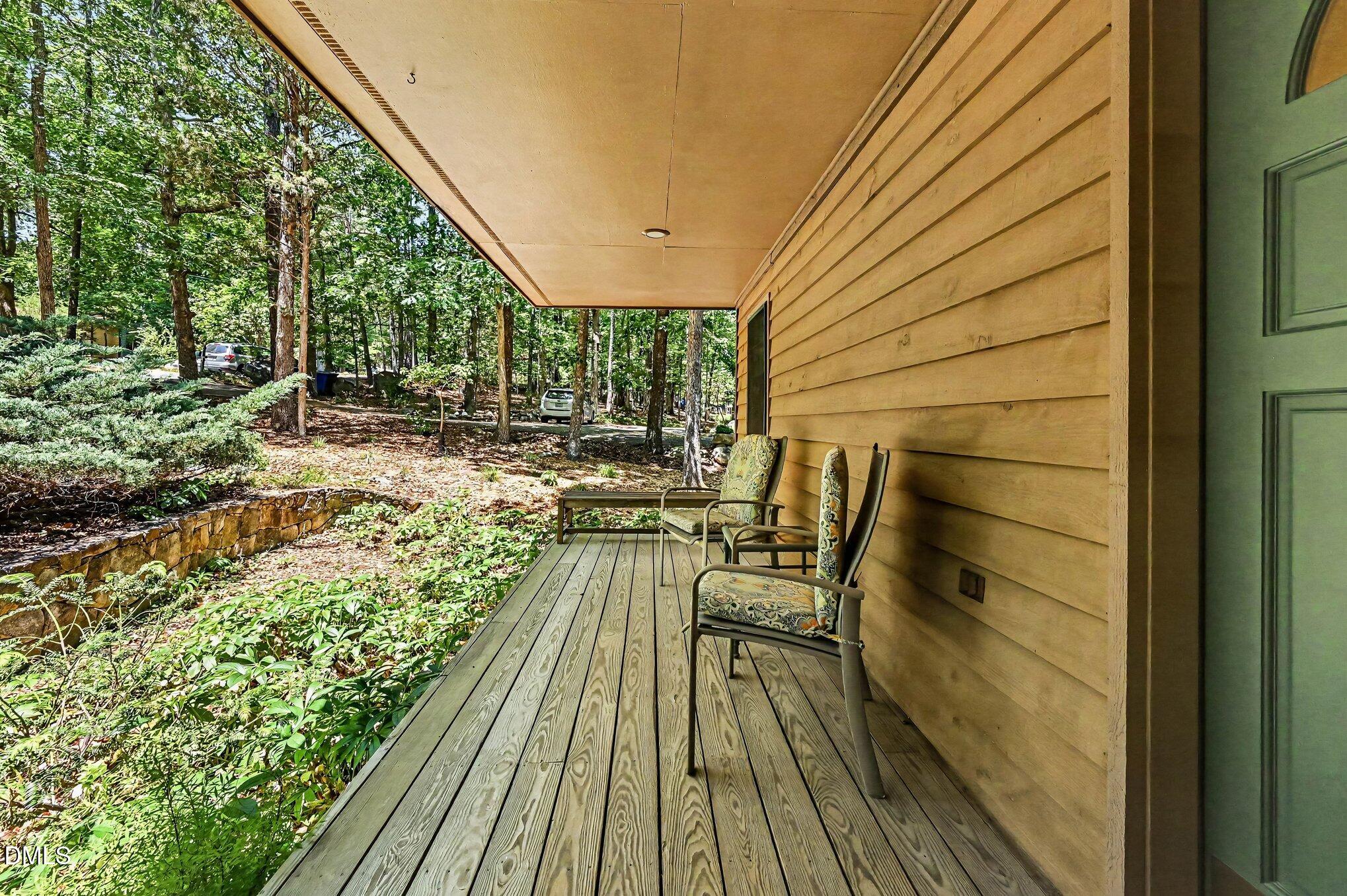 200 Spring Valley Road Carrboro, NC 27510 - Photo 4 of 38 a view of balcony with wooden floor and outdoor seating