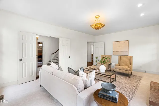 a living room with furniture and a table