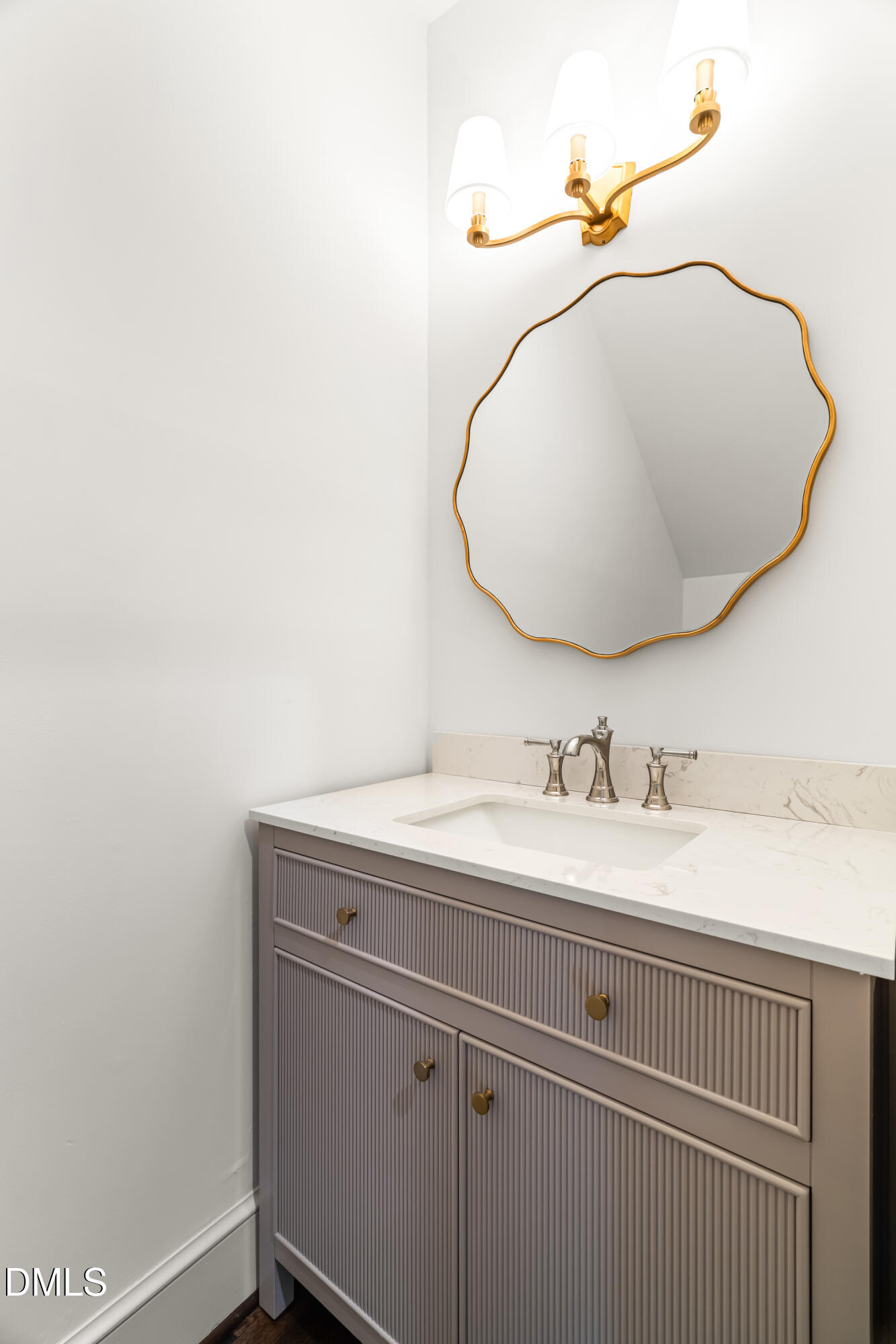 1015 Mulberry Road Clayton, NC 27520 - Photo 22 of 46 a bathroom with a sink and a mirror