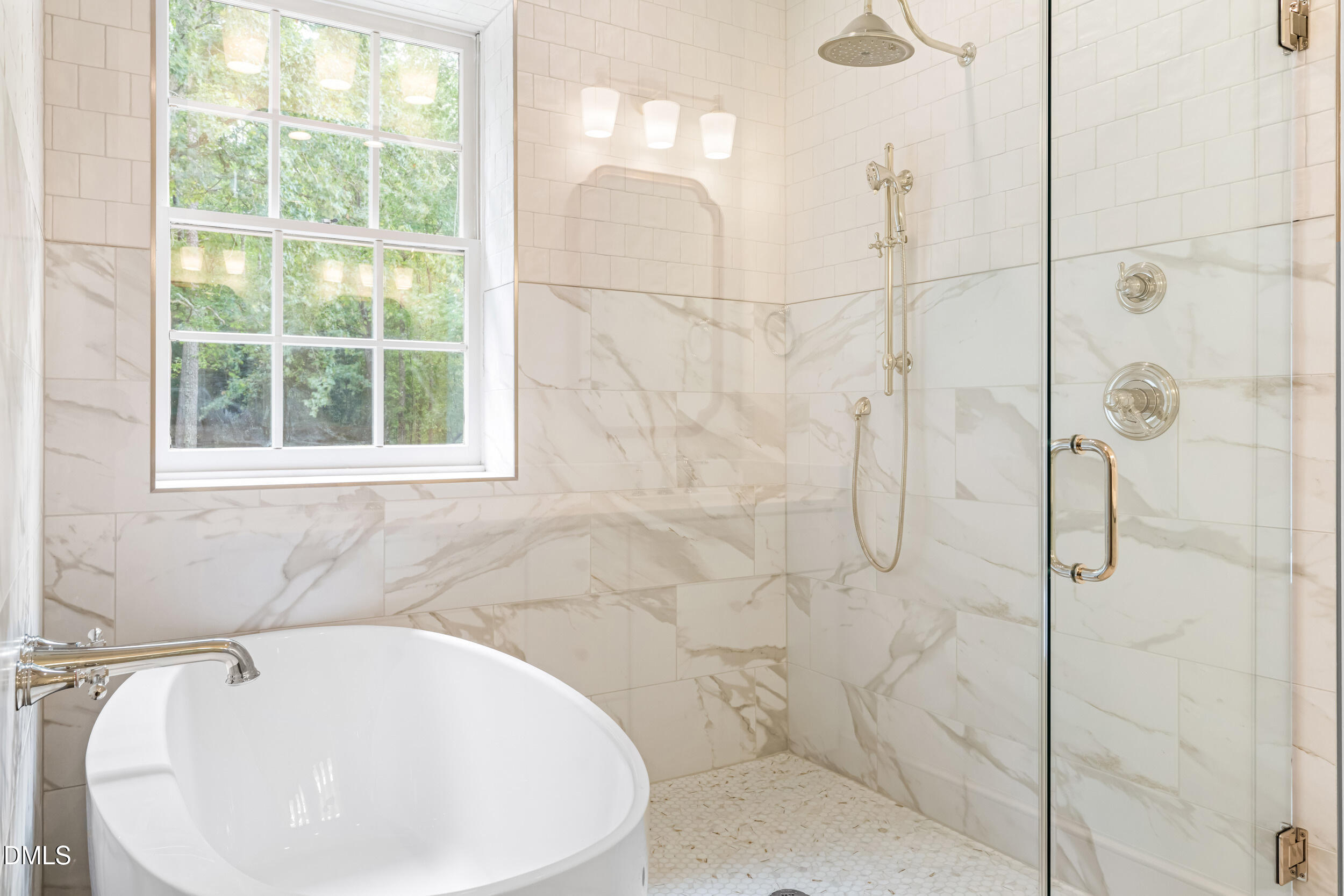 1015 Mulberry Road Clayton, NC 27520 - Photo 29 of 46 a bathroom with a white bath tub sitting next to a window