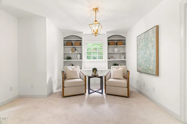 a bathroom with a white bath tub sitting next to a window