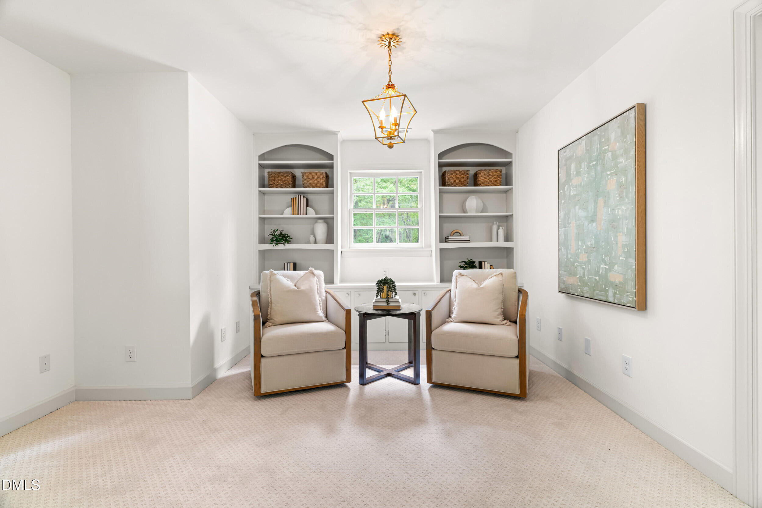 1015 Mulberry Road Clayton, NC 27520 - Photo 30 of 46 a living room with furniture a chandelier and a window