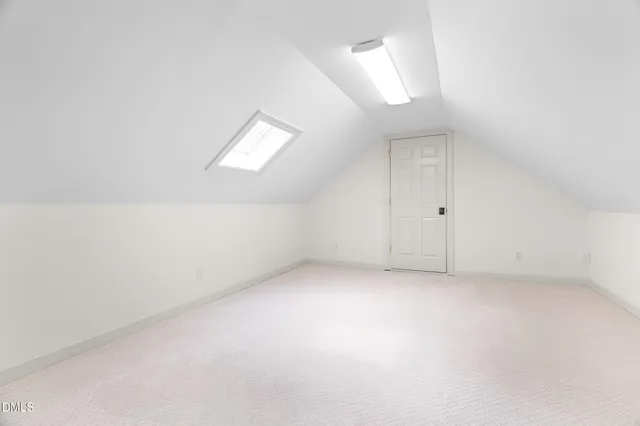 an empty room with wooden floor and window