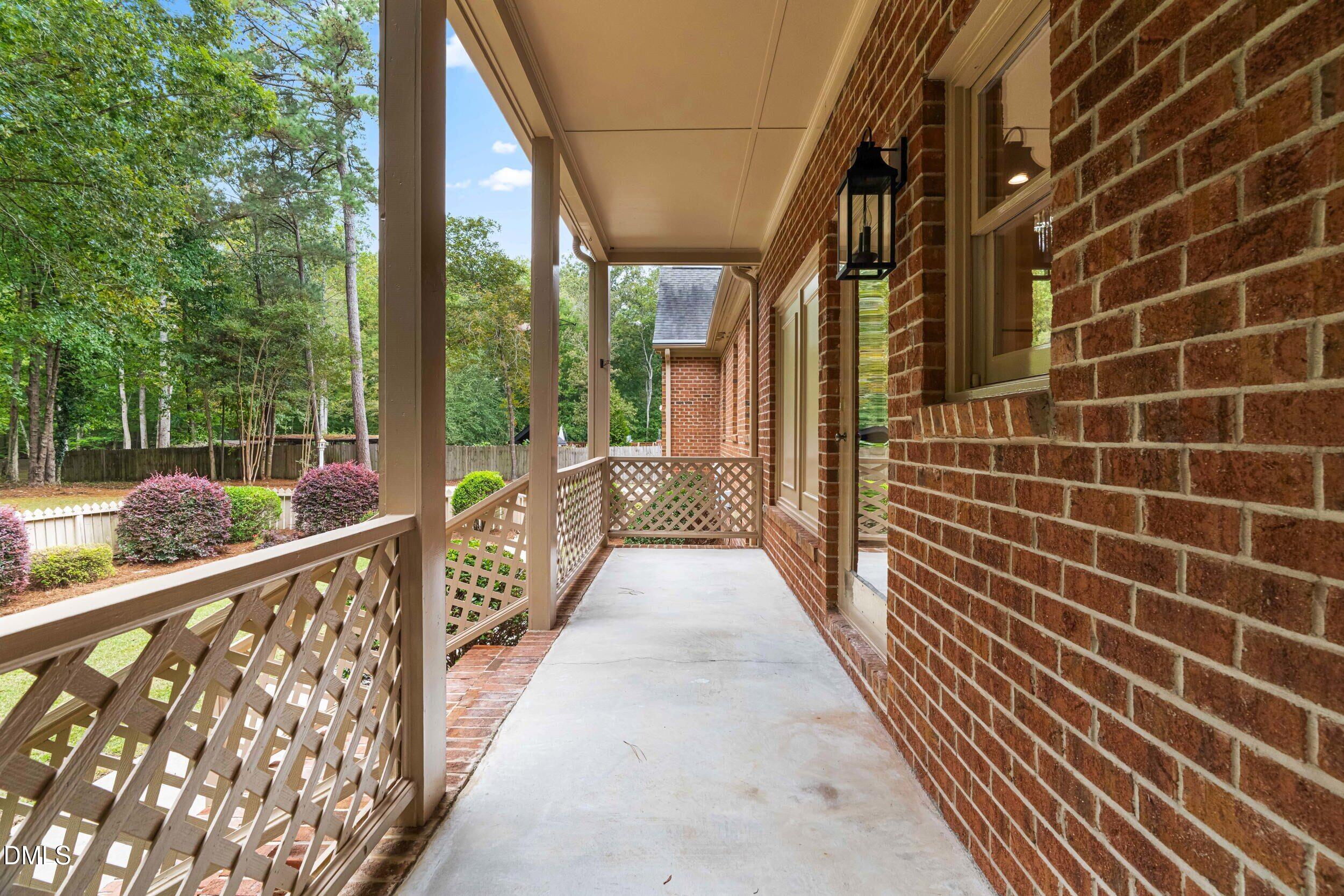1015 Mulberry Road Clayton, NC 27520 - Photo 39 of 46 a view of a balcony with wooden floor and stairs