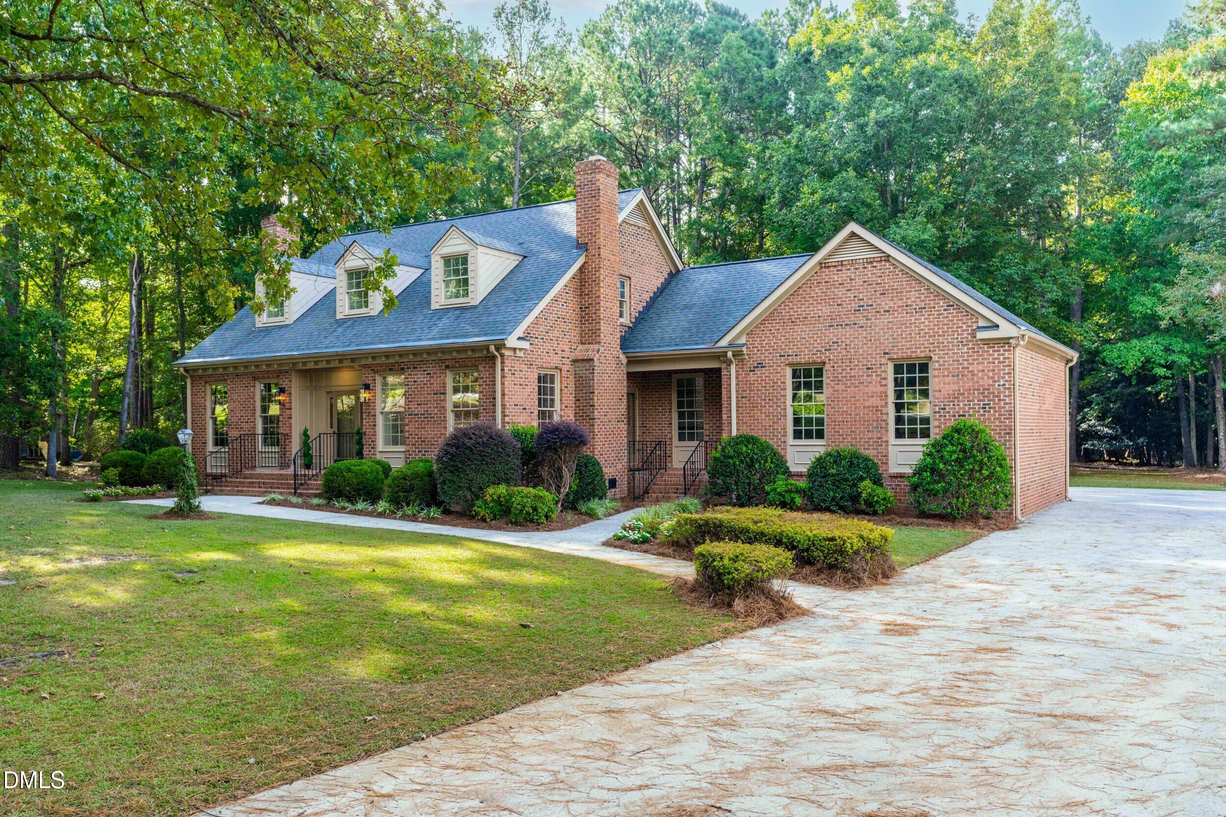 1015 Mulberry Road Clayton, NC 27520 - Photo 6 of 46 a front view of a house with a yard