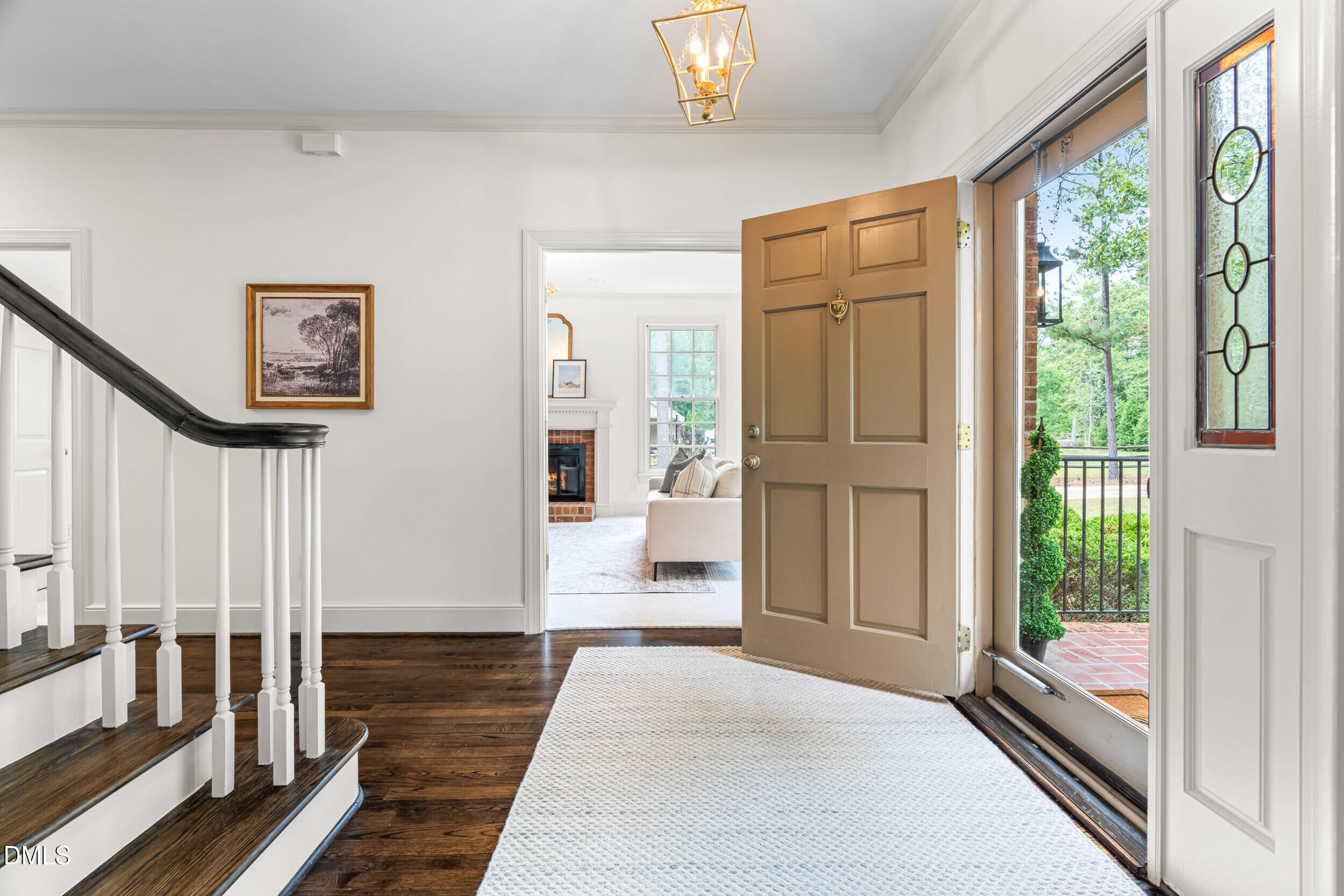 1015 Mulberry Road Clayton, NC 27520 - Photo 8 of 46 a hallway with wooden floor and windows