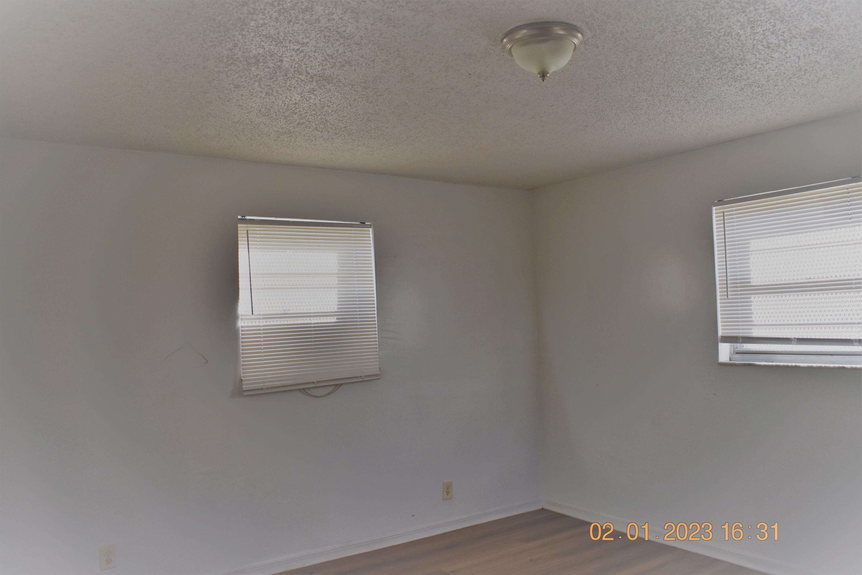 1305 West 25th Street Riviera Beach, FL 33404 - Photo 4 of 10 an empty room with a window