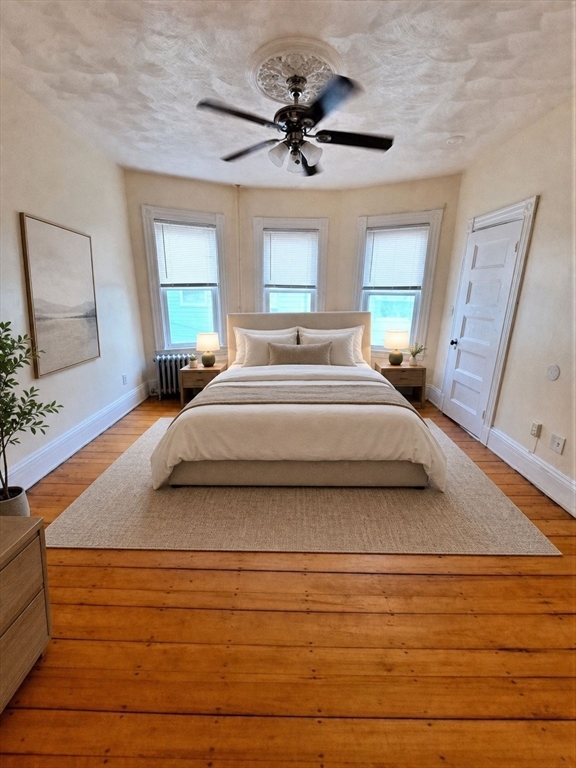 35 Catawba Street, Unit 2 Boston, MA 02119 - Photo 8 of 15 a bedroom with a bed and window