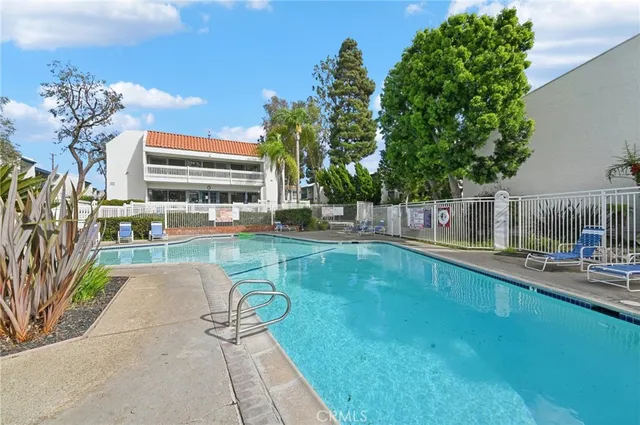 a view of a swimming pool with a patio