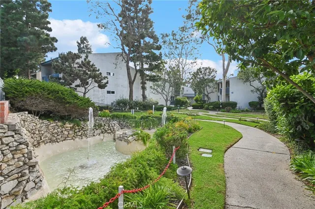 a view of a garden with a fountain
