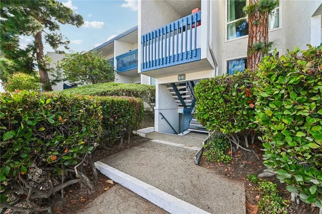 a view of a chair and table in the patio