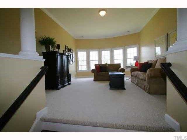 2005 Falls Farm Crossing Raleigh, NC 27614 - Photo 9 of 12 a living room with furniture and a flat screen tv