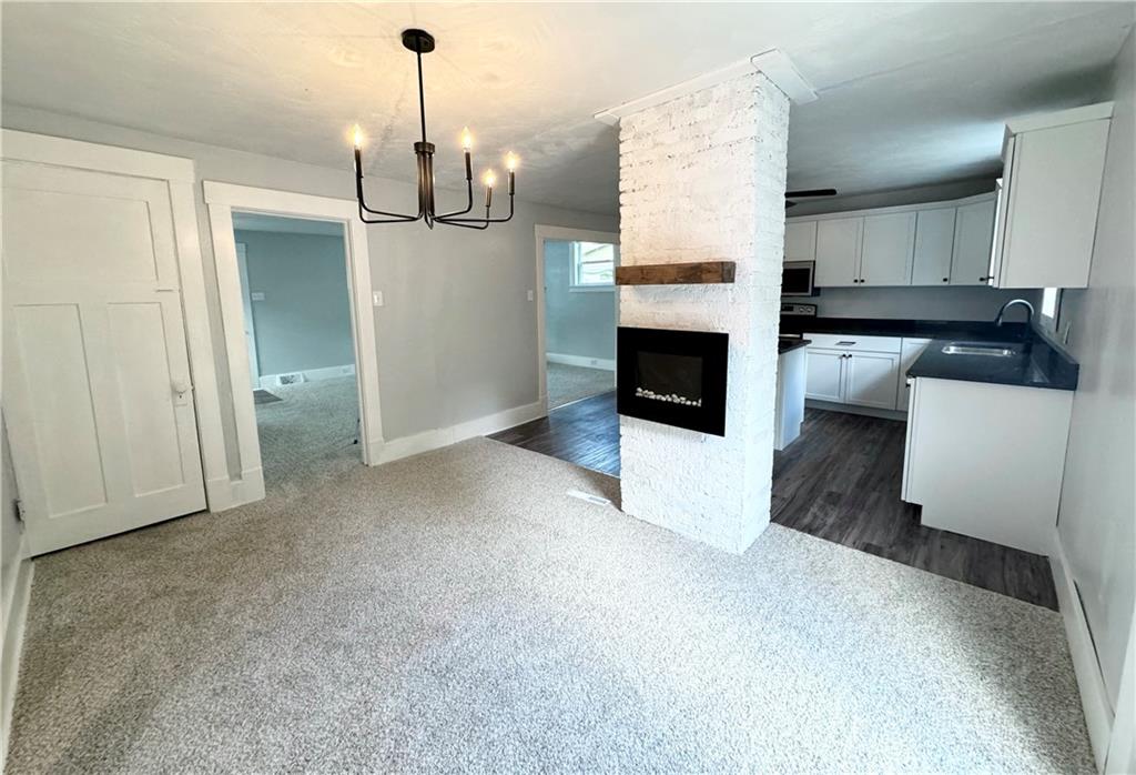 408 20th Street Beaver Falls, PA 15010 - Photo 17 of 27 a living room with furniture and a fireplace